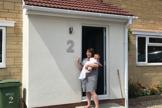 white-colour-rendered-house-extension-in-stroud-with-happy-home-owner