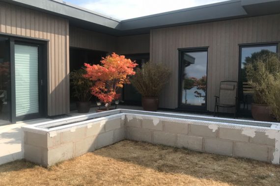breeze block exterior wall before colour rendering applied