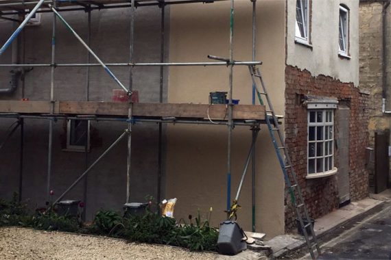 red brick house preparation-with-scratch-coat-render-before colour rendering applied