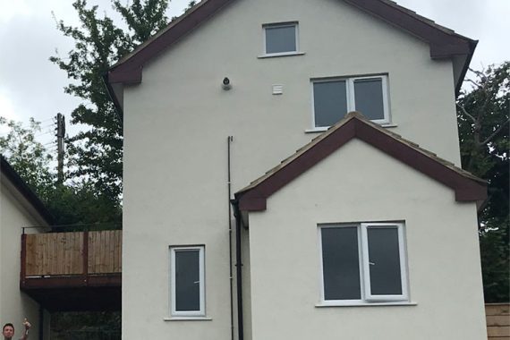 timber frame house with external wall insulation with white colour render-